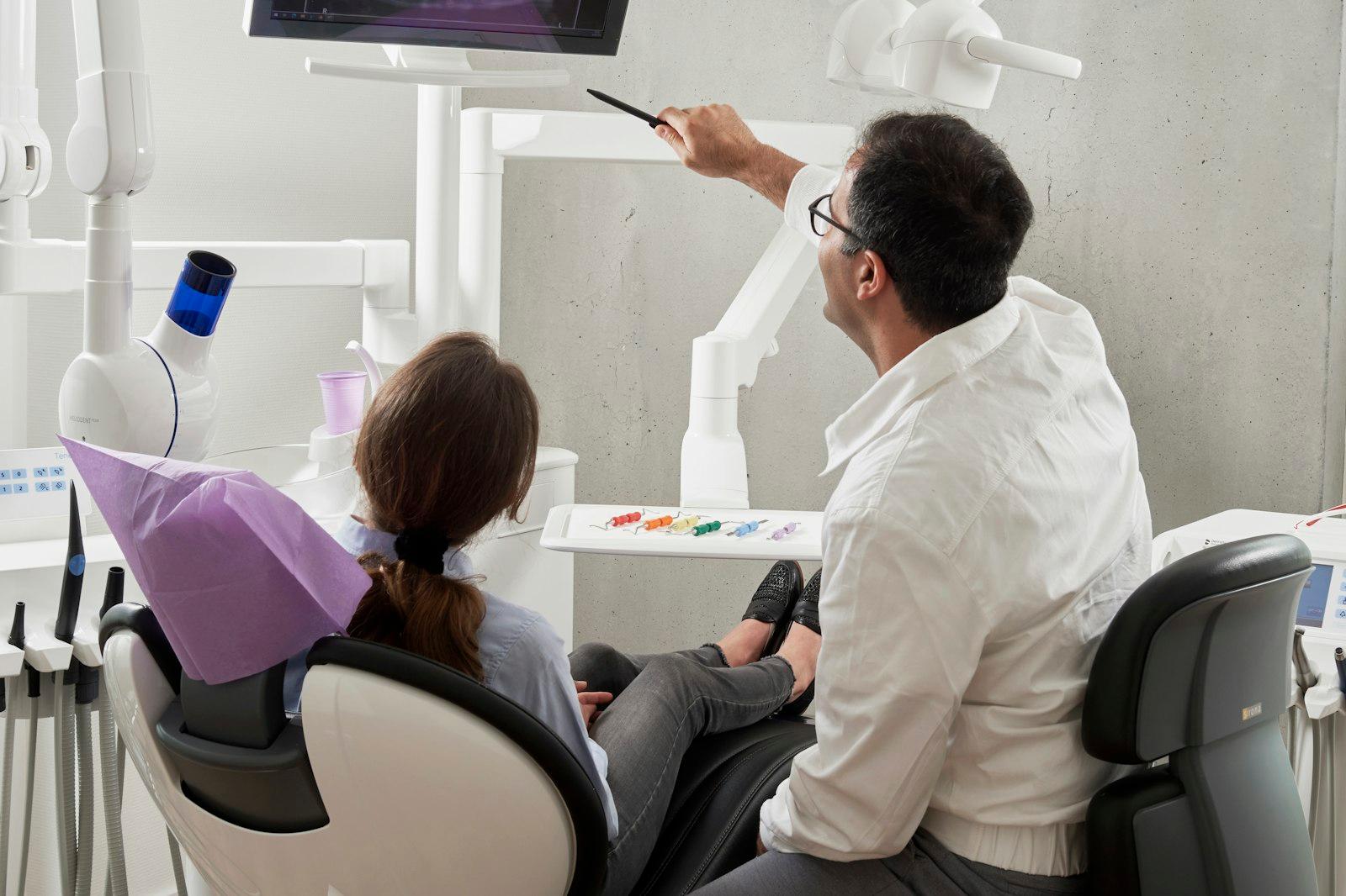 Dentist and assistant working in an operatory
